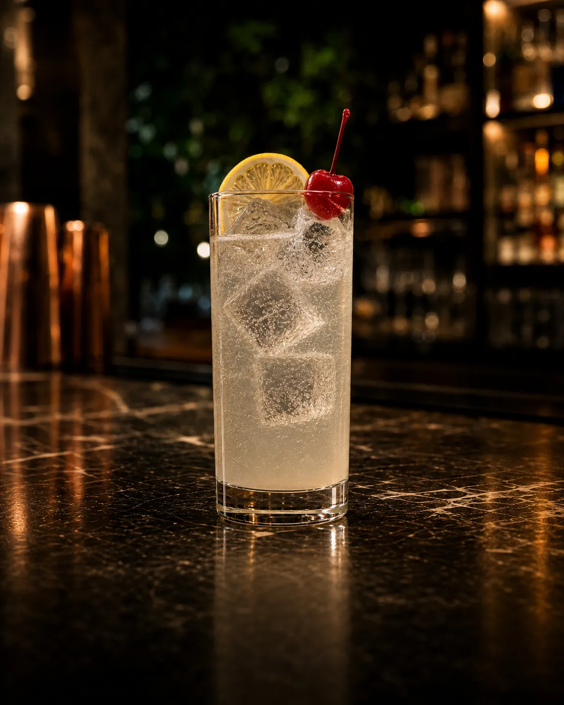 John Collins, long drink. Glass: Highball glass